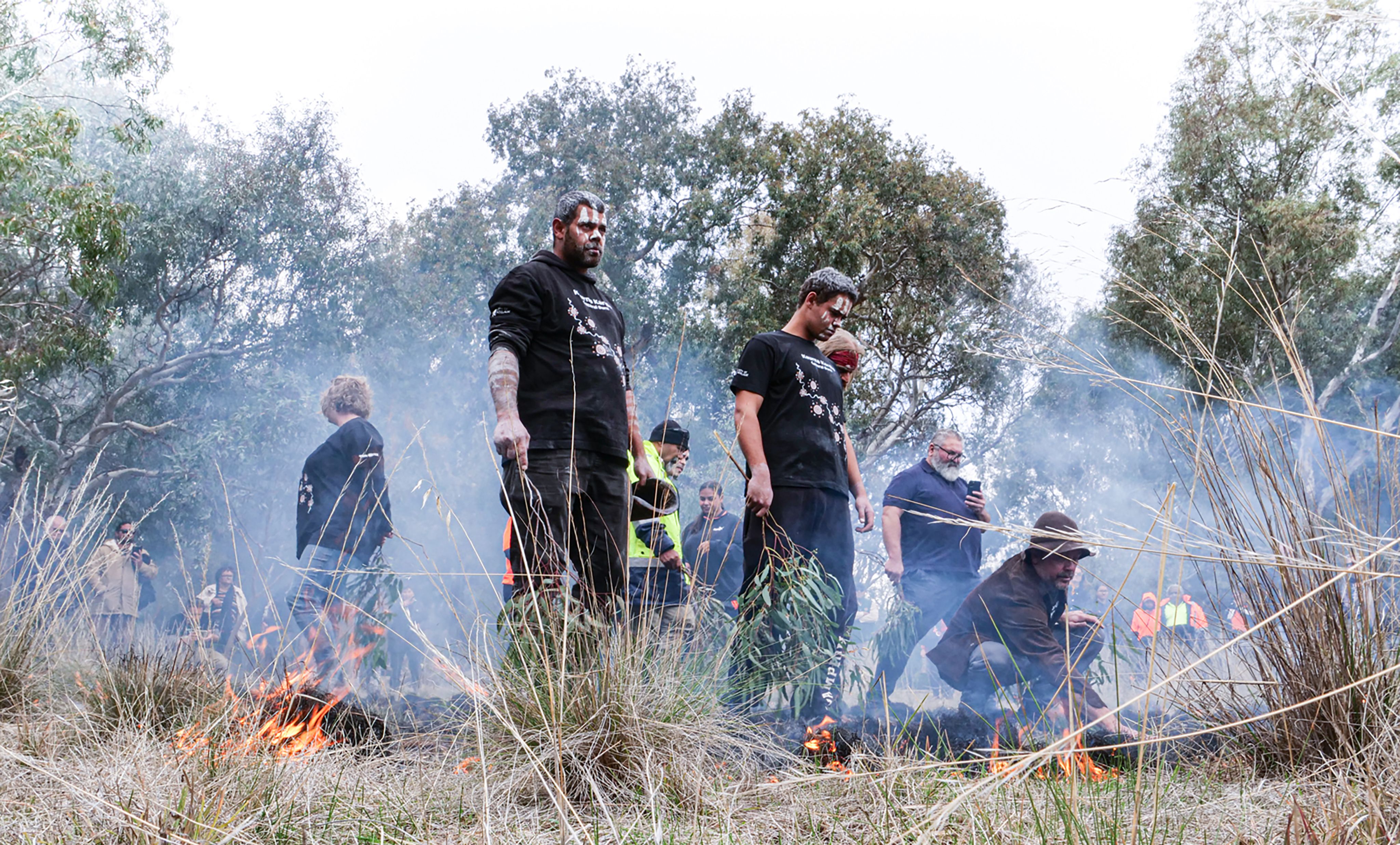 In November 2019 the City of Adelaide’s Horticulture Team, project managers and members of the Kaurna community met in the heart of the city with traditional fire practitioner, Victor Steffensen (seen crouching in this photograph)