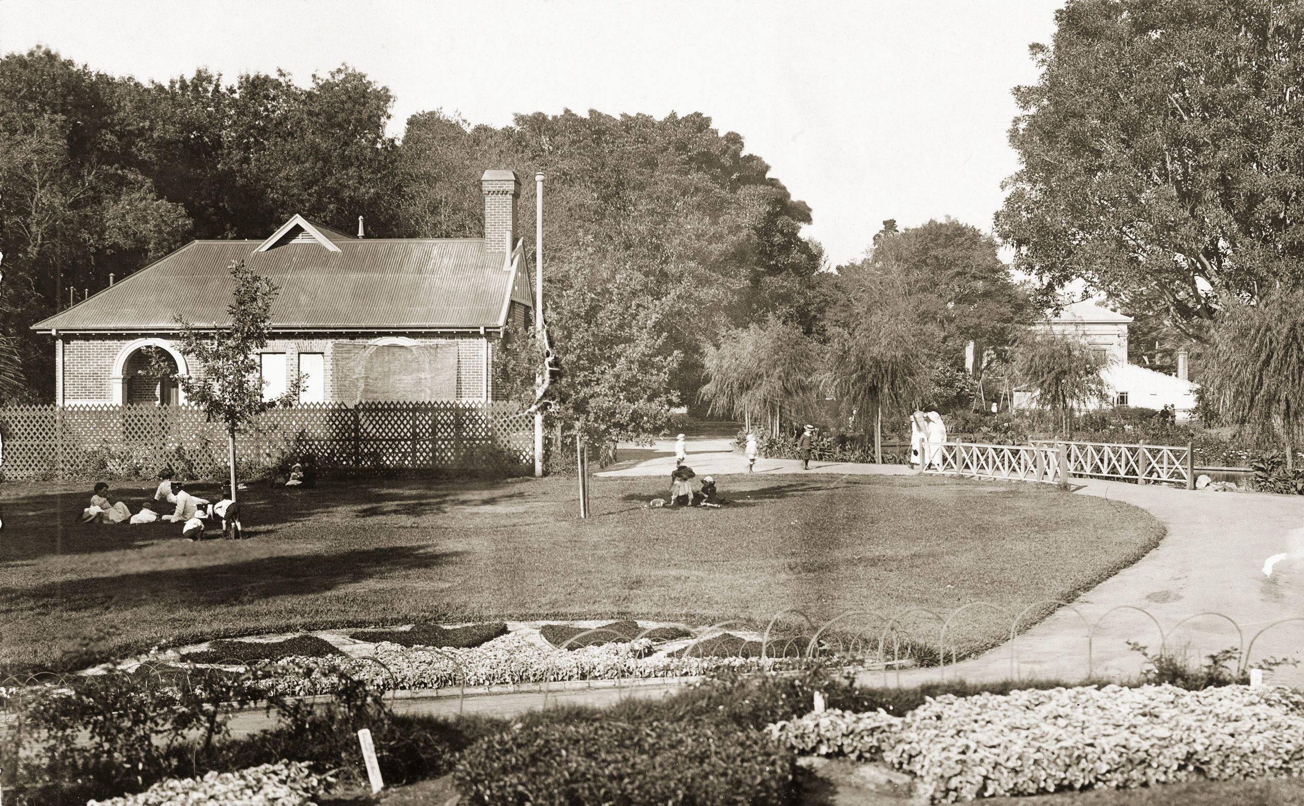 Small group of people gathered in the Adelaide Botanic Gardens, 1927. SLSA: B 4392