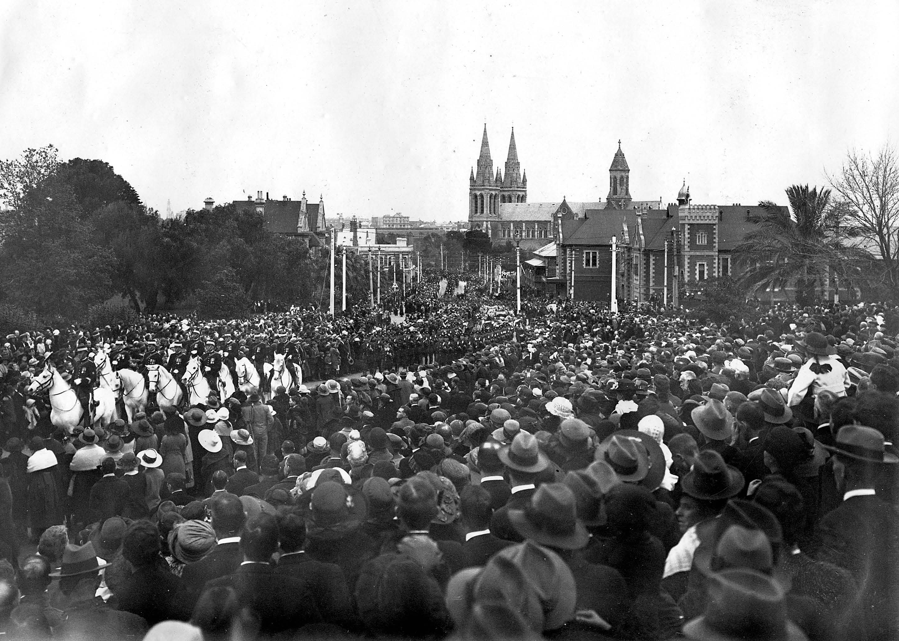 Crowds lining the procession led by mounted police from the cathedral to North Road cemetery. SLSA: PRG 280/1/36/344
