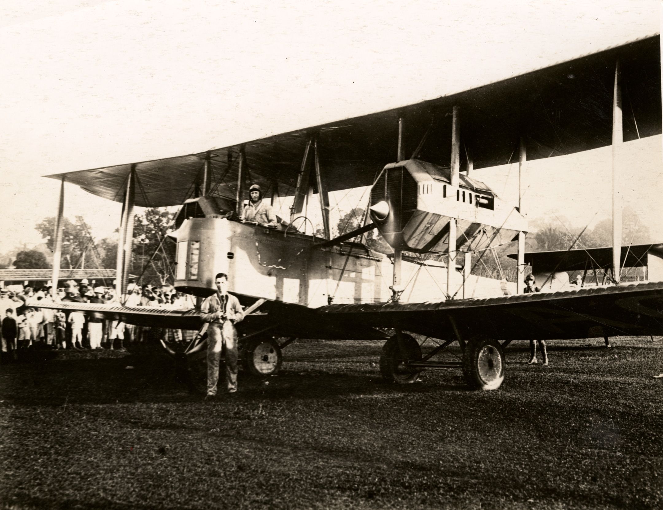 Ross and Keith Smith (centre) and James Bennett (right, behind wing), posing with the Vickers Vimy at Surabaya, Indonesia, 7/12/1919. SLSA: PRG 18/7/32