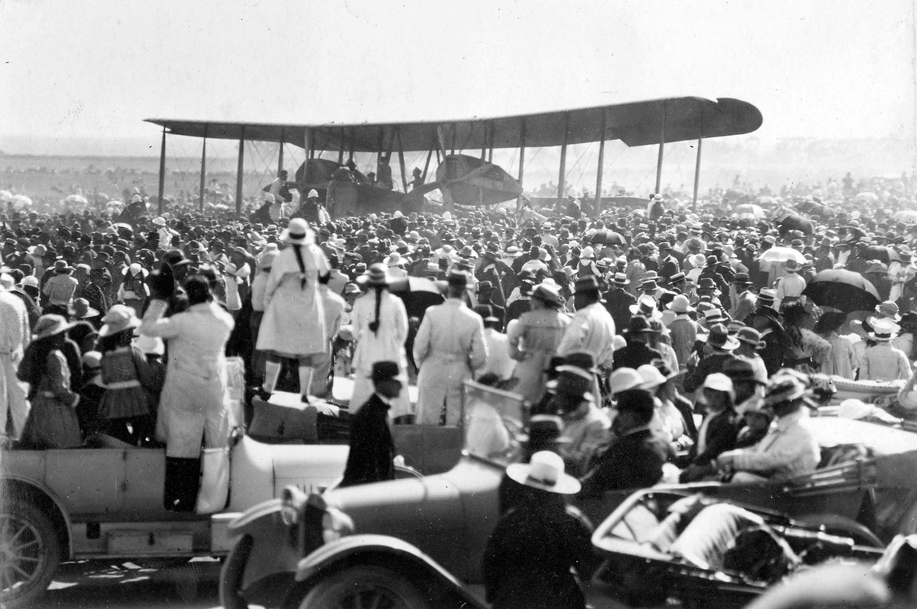 People stood on boxes to gain a better view of the Vimy at Captain Harry Butler’s aerodrome at Northfield. SLSA: PRG 280/1/19/55