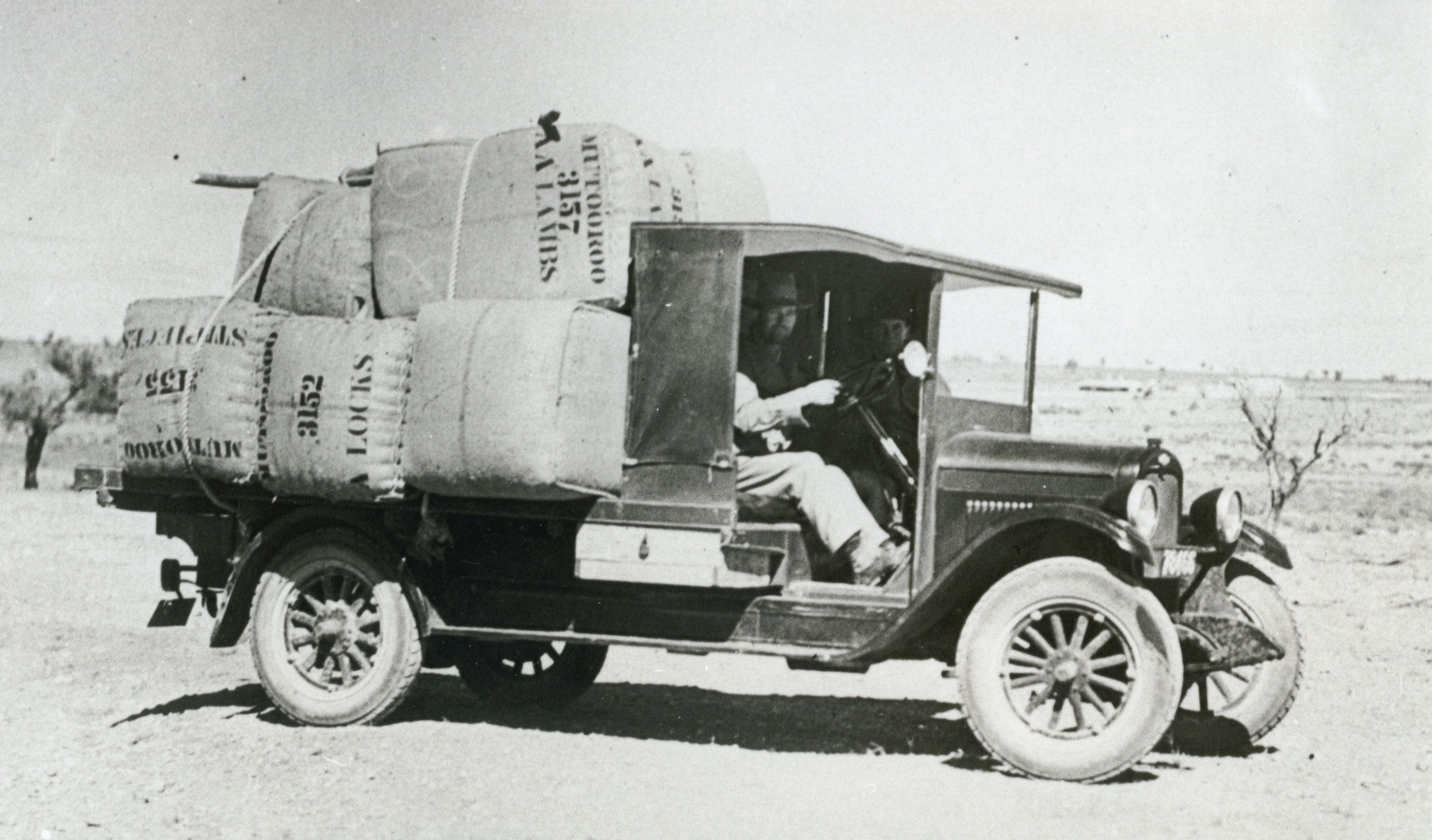 Bales of Mutooroo wool being transported in a Chevrolet truck from the station circa 1927.The merino sheep on Mutooroo were bred hardy enough to walk long distances to water. SLSA: B 61990