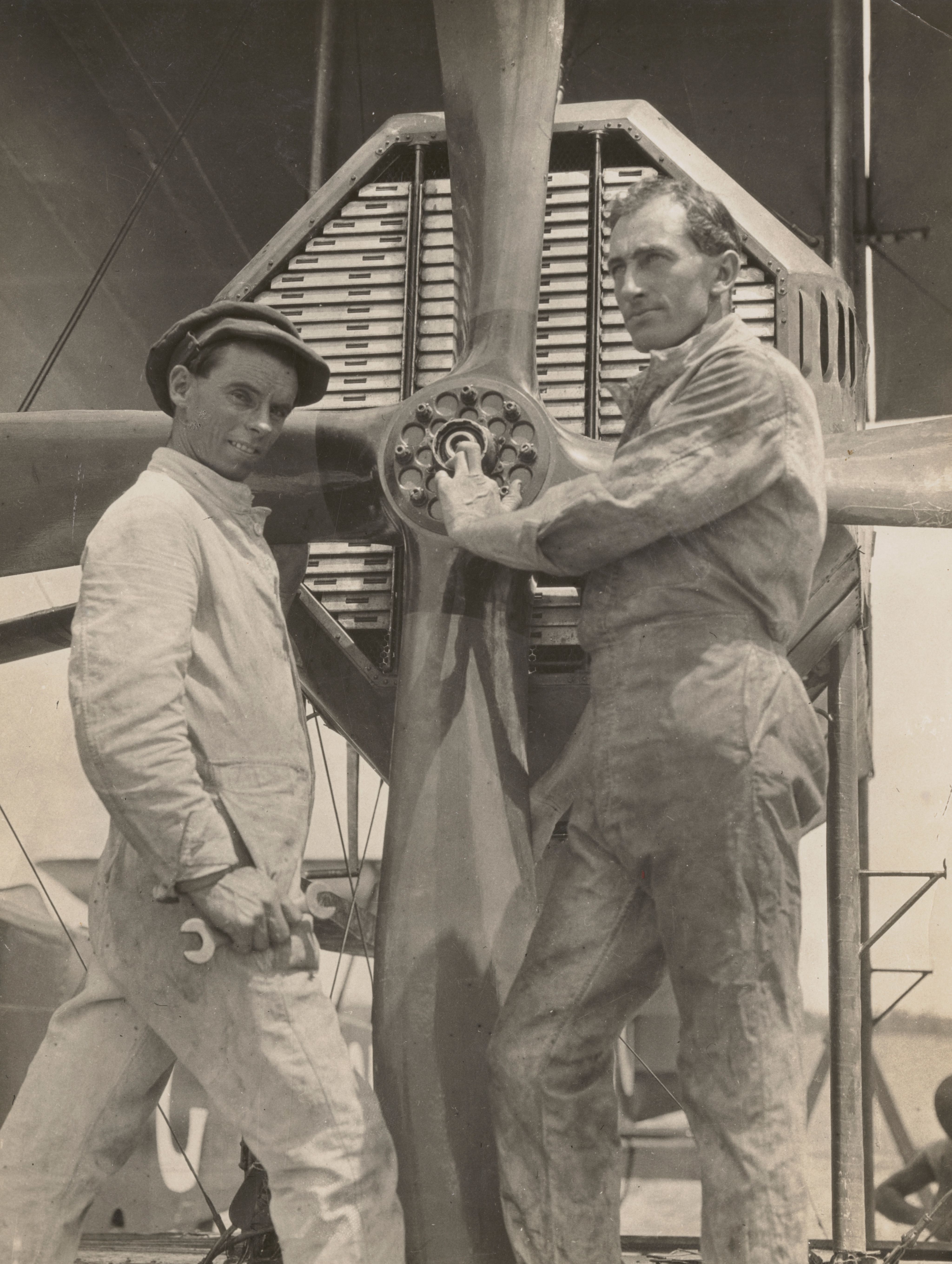 Flight engineers Wally Shiers and James Bennett assessing the engine and propellerof the Vickers Vimy c1919. SLSA: PRG 18/8/7