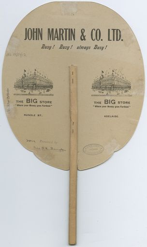 A hand-held fan commemorating the first England to Australia aerial flight in 1919 by the crew of the Vickers Vimy G-EAOU aircraft. Produced and sold by John Martin & Co. Ltd. SLSA: PRG1701/3/2