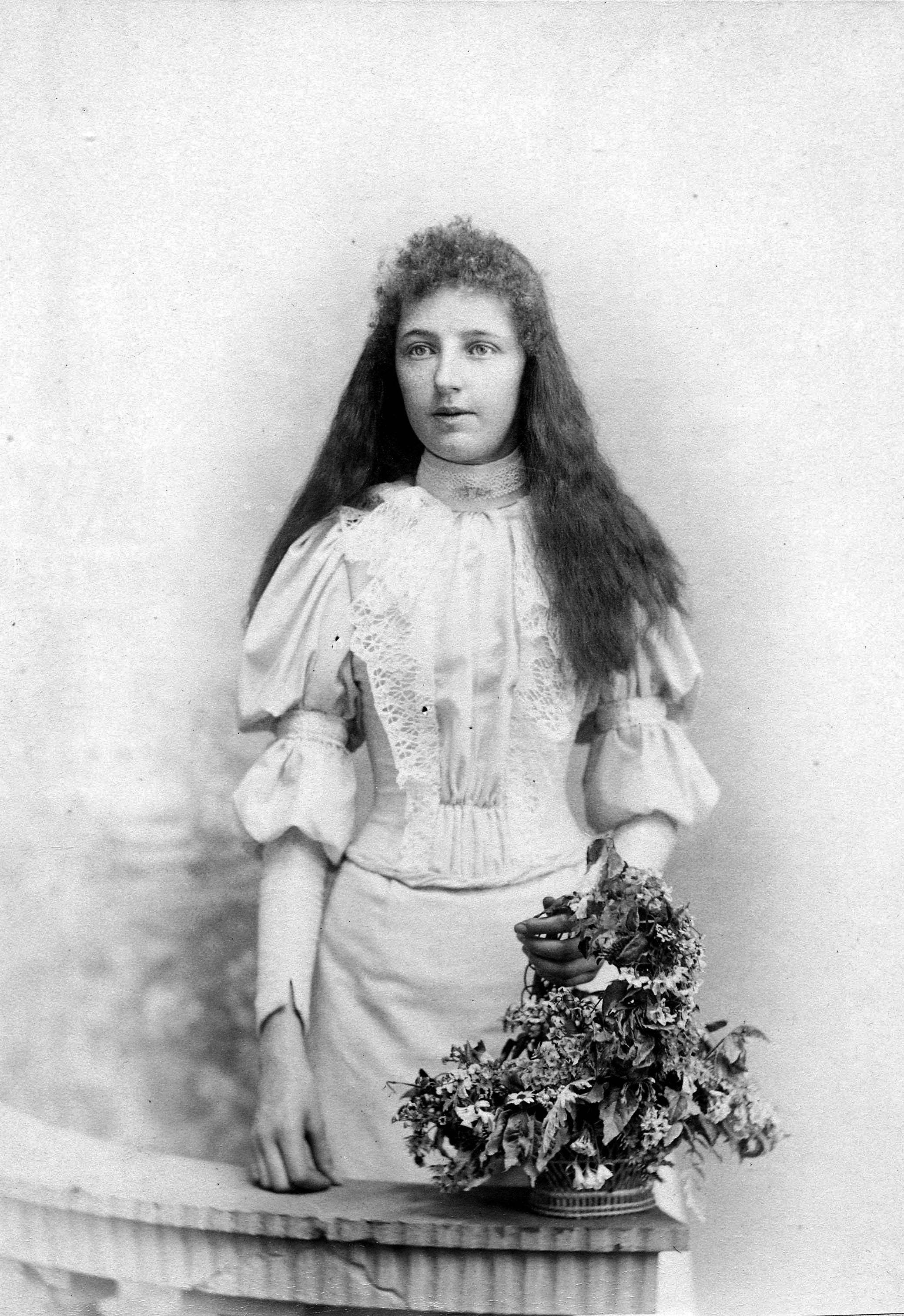 Studio portrait of Lottie Richards (later Michell) as a young woman. The State Library of SA holds Lotties badge collection. SLSA: PRG 903/10