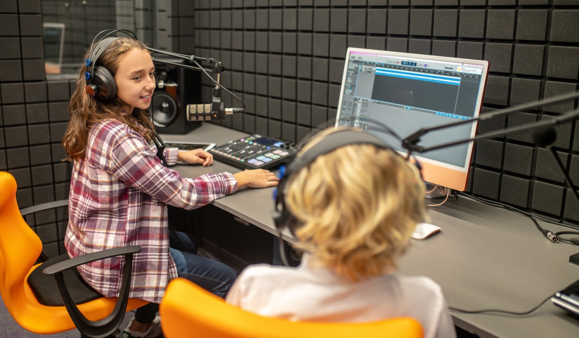Participants in a podcasting workshop