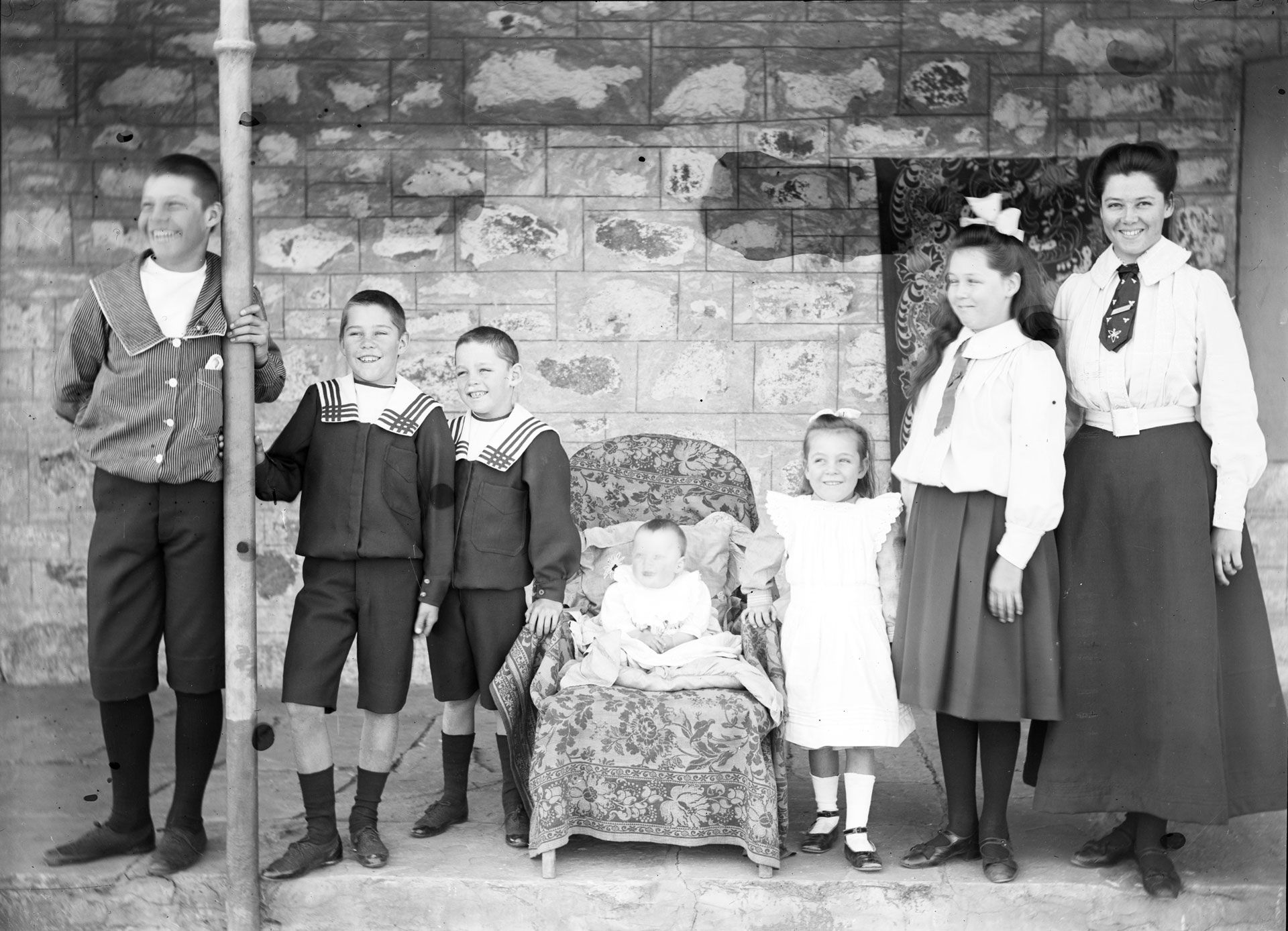 The Bradshaw kids scrubbed to a high shine for a photo,1907. The young woman on the right is perhaps the governess or teacher. Doris Bradshaw noted that many different ladies worked with her family over the years. 1907. SLSA: B 70589/7