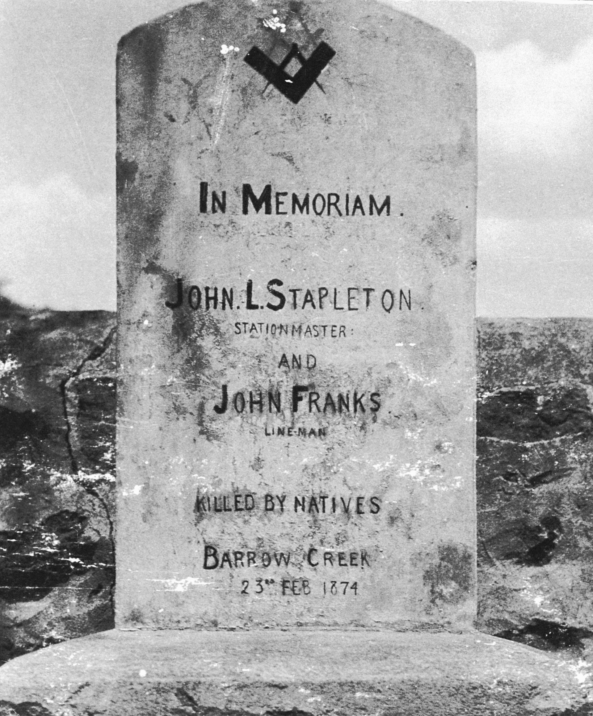 The stone memorial to telegraph employees James L. Stapleton, stationmaster, and John Franks, linesman at Barrow Creek, where they were buried, a few steps from the station. The memorial has since been replaced. Photographed by Philip John Brewer, 1925. SLSA: B 62582
