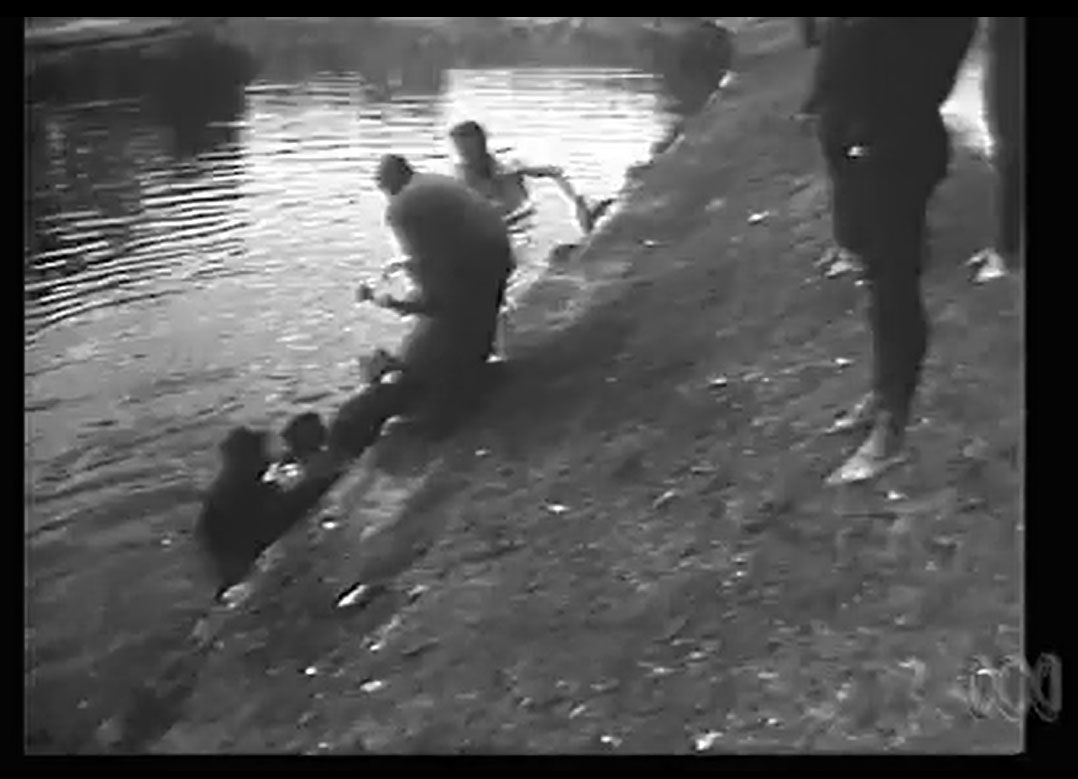 Dr Duncan's body being pulled out of the River Torrens. Screen capture, This Day Tonight. ABC, 19 July 1972.