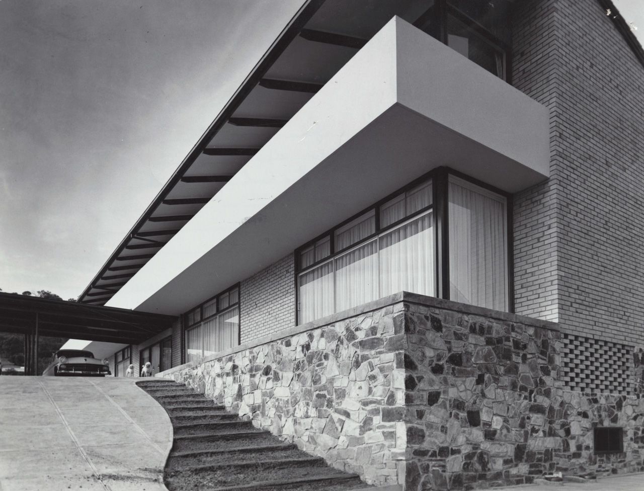 Photograph of house on Balfour Road, Springfield, built for Alf Brown and designed by John S. Chappel Pty Ltd, architect. Showing side view with carport, February 1962. SLSA: BRG 346/29/27/2