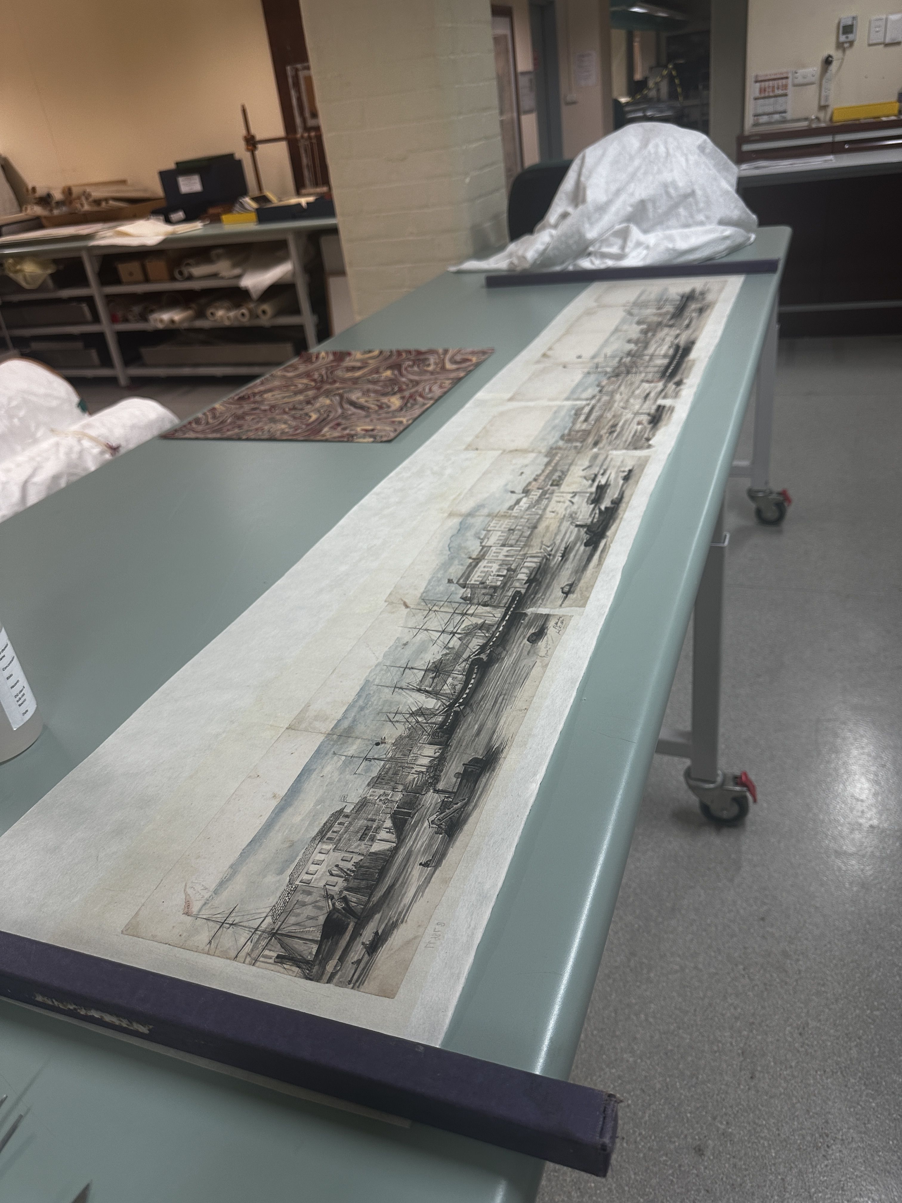 The panorama post-conservation treatment and mounted on the new Japanese tissue backing paper.