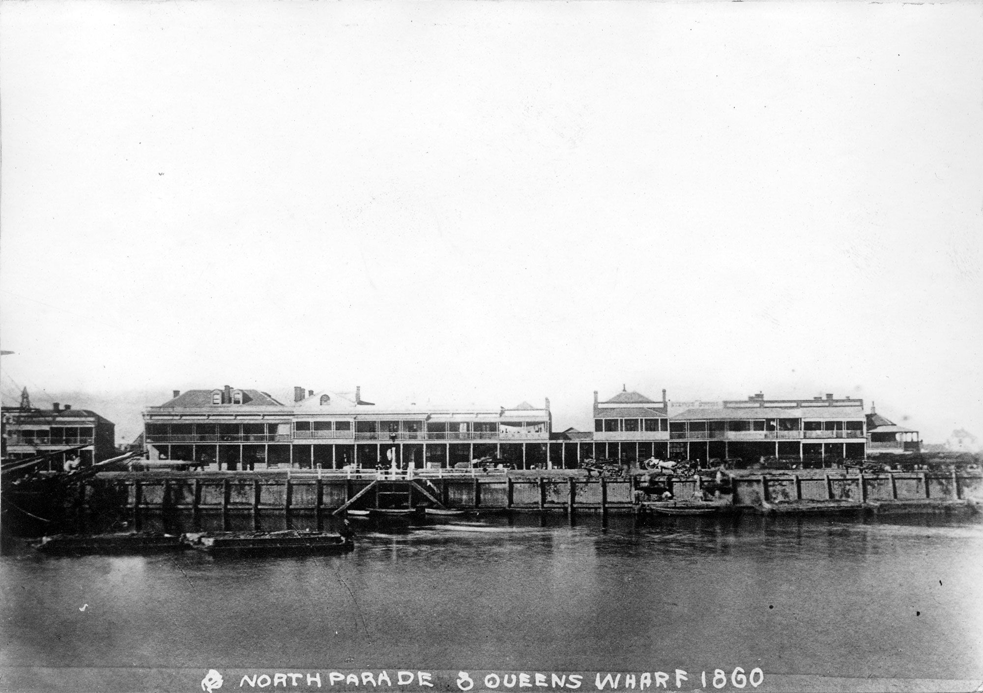 A photograph showing a distant view of Queen's Wharf and North Parade, Port featuring the hotels and shops in 1860. SLSA: PRG 280/1/14/126 