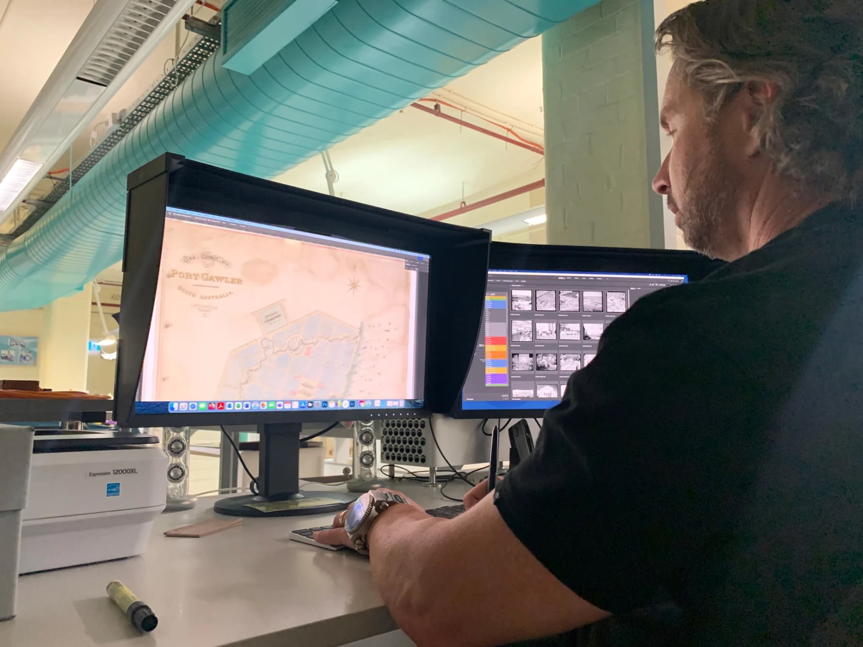 Toby Woolley mastering the digital file of the Port Gawler map. Photograph: SLSA, Feb 2023