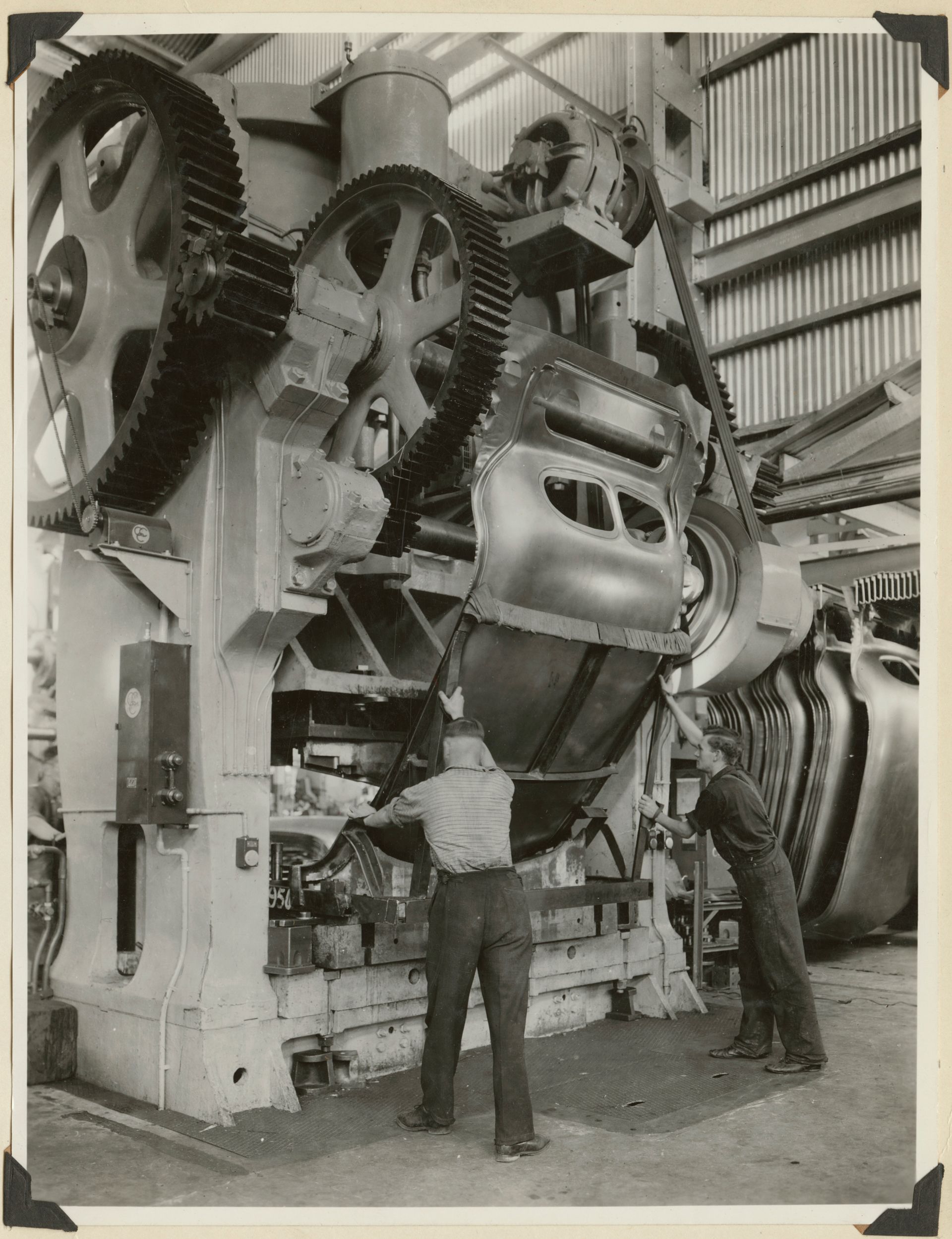 720 ton single action Hamilton Press performing an operation on roof panel Holden's Woodville plant, 1939. SLSA: BRG 213/77/48/13